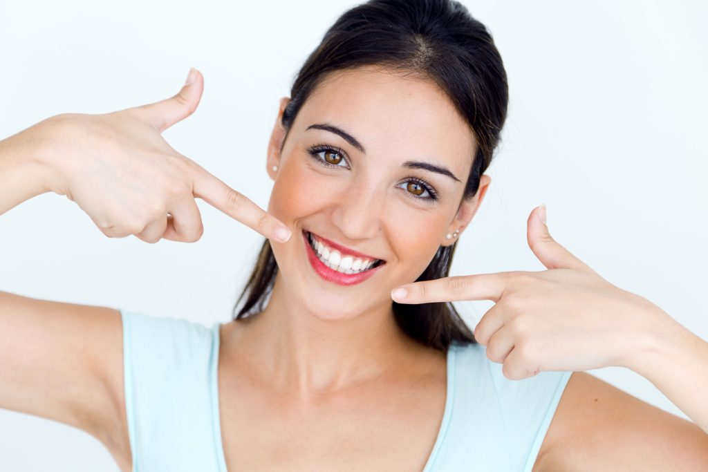 patient feeling happy with new teeth